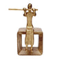 Golden musician figure seated