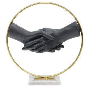 Black shaking hands in gold circle